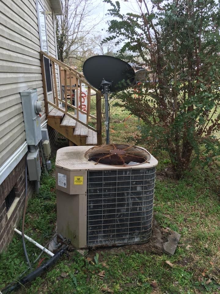 AC condenser unit serviced in a backyard in Erwin, NC